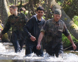 river hiking fully clothed